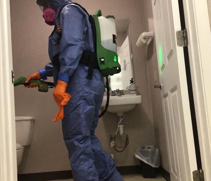 Man cleaning a commercial restroom in Albany, GA